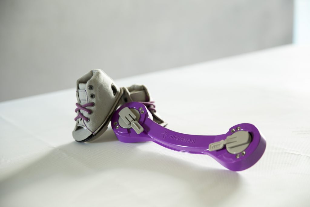 A brace and custom shoes supplied by MiracleFeet as part of its clubfoot treatment program